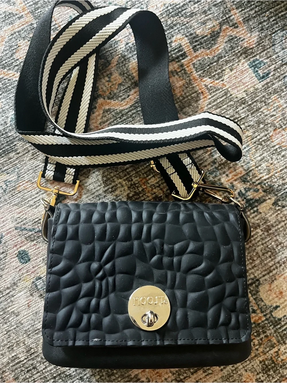 MOOST Black Quilted Crossbody Bag with Striped Strap
